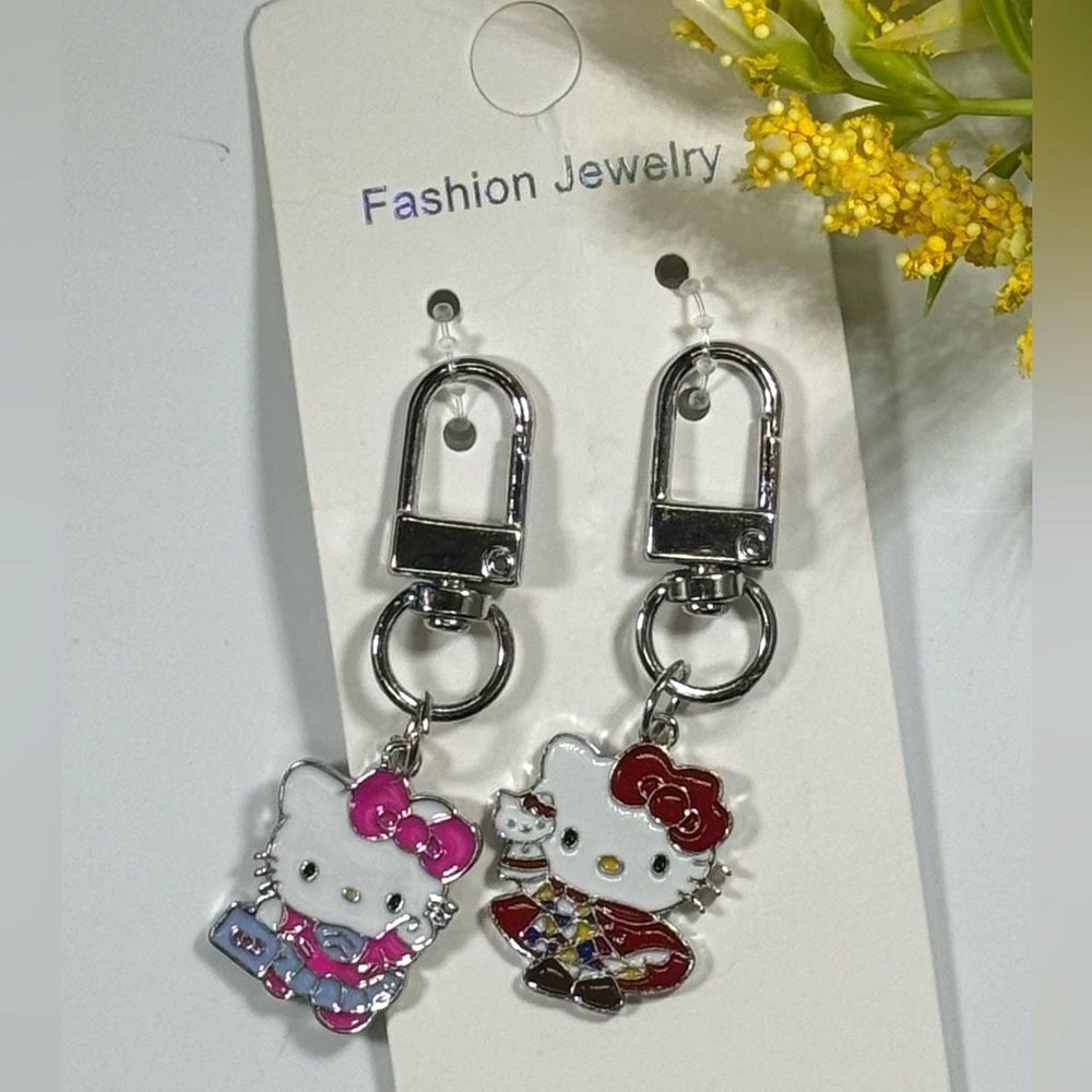 BAG CHARM Hello Kitty Set of 2 Silver Tone Pink And Red Charm Keychain Bag…